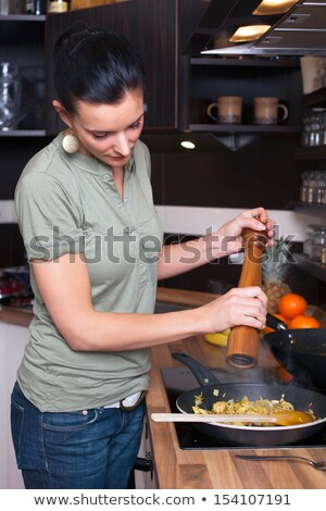 Foto stock: Woman Salt Egg In A Frying Pan