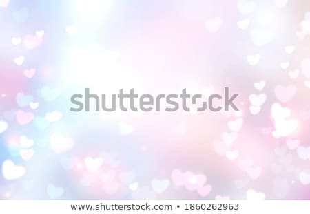 Foto d'archivio: Valentines Day Abstract Background Of Soft Blue White Bokeh Blur Hearts