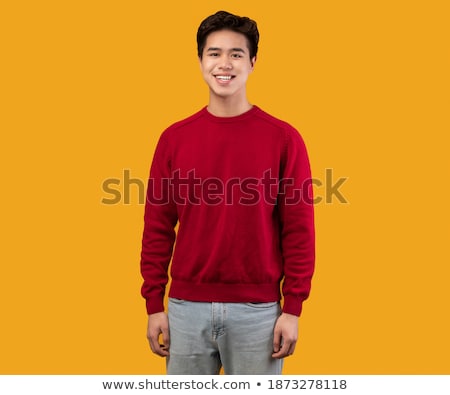 [[stock_photo]]: Emotional Young Asian Man Posing Isolated Over Yellow Background