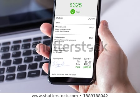 [[stock_photo]]: Businessperson Paying Invoice On Mobile Phone