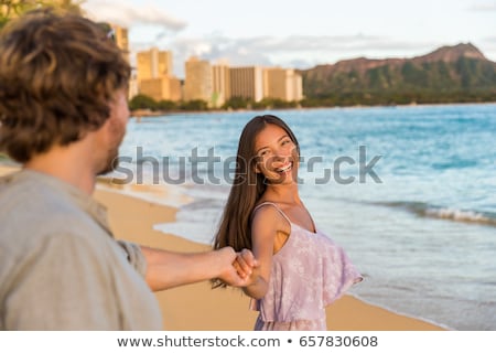 Couple Relaxing Holding Hands Having Fun On Waikiki Beach Hawaii Vacation Happy Tourists People In Stockfoto © Maridav