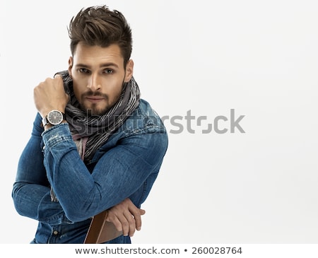 Stok fotoğraf: Thoughtful Fashion Man With Long Beard Is Sitting In Studio