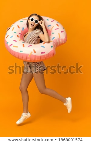 Foto stock: Cheerful Girl In Inflatable Pool