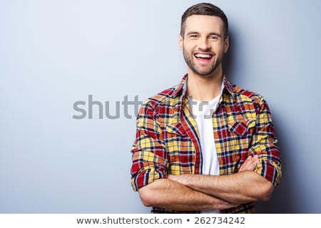 Foto stock: Young Elegant Man Against Gray