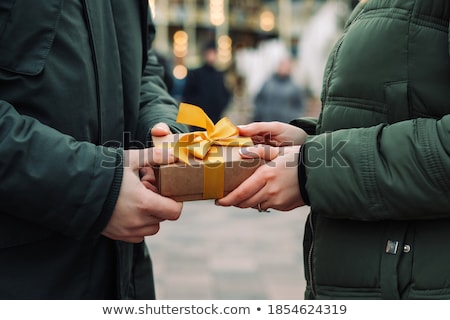 Stock photo: Young Woman Receiving Small Giftbox