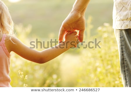 Сток-фото: Parent Holds The Hand Of A Small Child