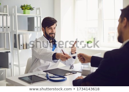 Zdjęcia stock: Doctor Giving Prescription To Male Patient