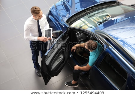 ストックフォト: Business Man Working At A Car Dealer