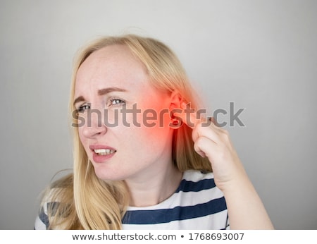 Foto stock: Woman Suffering From Sore Ear