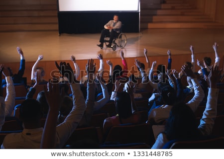 Сток-фото: High View Of Caucasian Businessman Sitting On A Wheelchair And Giving Presentation To The Audience I