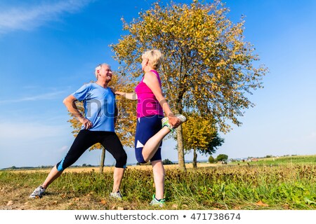 Couple Doing Gymnastics Outdoors Foto d'archivio © Kzenon