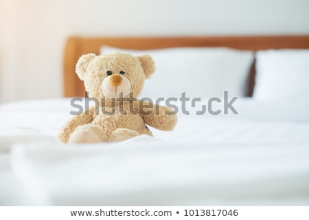 Foto stock: Lovely Girl Laying In Bed With Teddy Bear