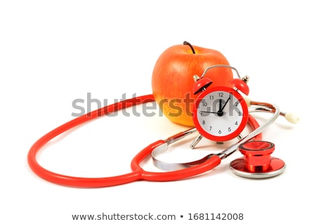 Foto d'archivio: Doctor Listening To Apple Heartbeat With Stethoscope