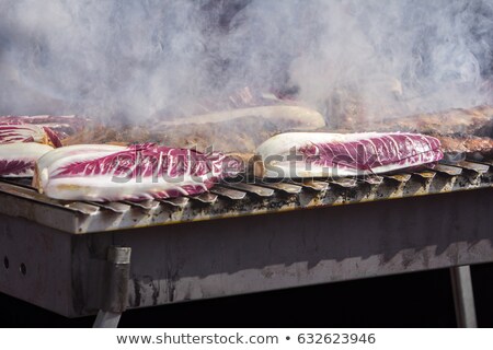 ストックフォト: Grilled Pork Ribs And Red Chicory On The Grill