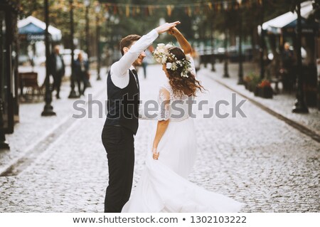 Foto stock: Bride And Groom Posing On The Streets