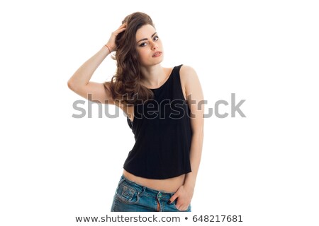 Stock photo: Brunette Girl In Feminine T Shirt And Ripped Jeans