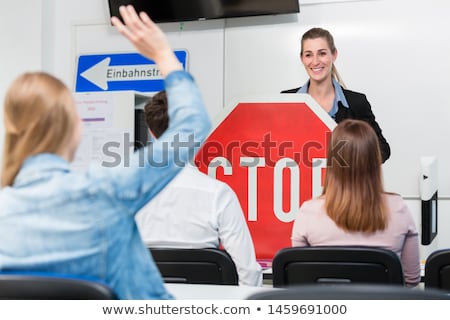 Foto stock: Teacher With Class Giving Driving Lessons