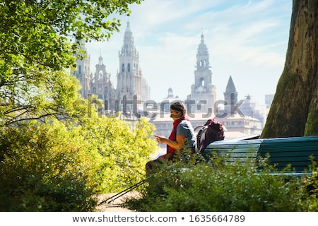 Foto stock: Tourist Woman On Pilgrimage At Santiago De Compostela With Phone