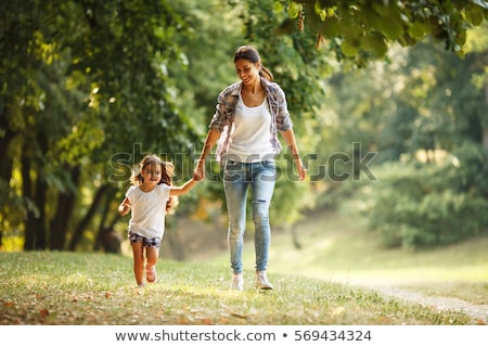 Stock foto: Little Girl And Mother In The Park