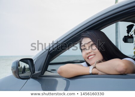 [[stock_photo]]: Woman Sat In Cabriolet At The Seaside