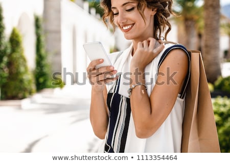 Foto stock: Brunette Woman With Mobile Phone