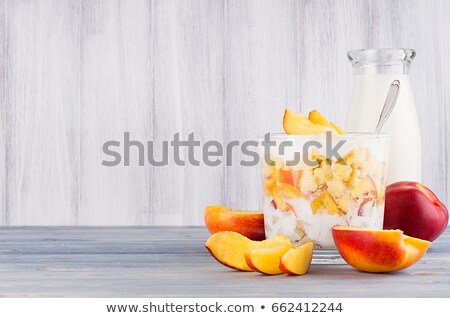 Foto stock: Healthy Breakfast With Corn Flakes Slice Peach And Milk Bottle On White Wood Board Decorative Bord