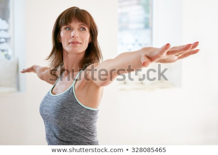 Stock foto: Mature Woman Practicing Yoga