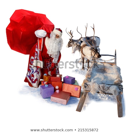 Сток-фото: Santa Claus On His Sleigh And Reindeer On Snow With Snow Capped