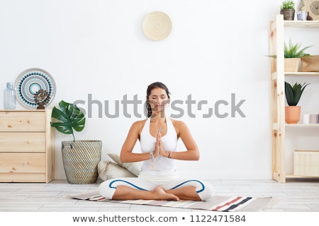 Stock photo: Portrait Of Beautiful Young Woman Relaxing After Doing Exercise