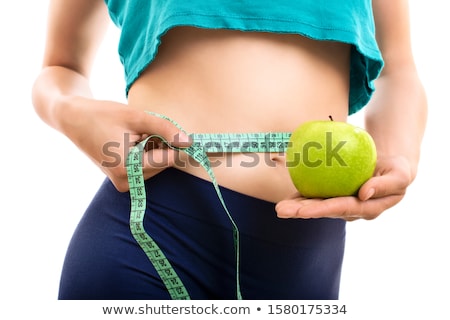 Stock fotó: Portrait Of Young Woman Measuring Her Waistline