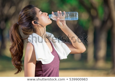 ストックフォト: Woman Drinking Water Sweating Exercising