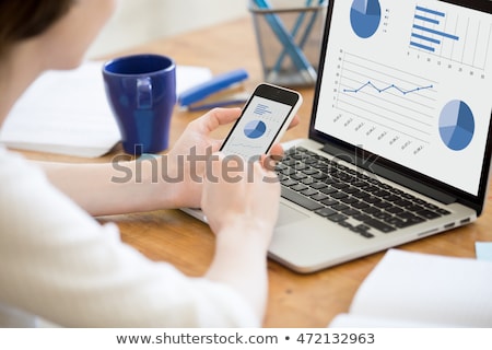 Foto stock: Woman Looking At Graph