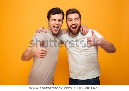 Stock fotó: Smiling Man Showing Thumbs Up