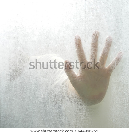 Imagine de stoc: Trapped Woman Back Lit Silhouette Of Hands Behind Matte Glass