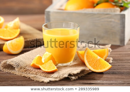 Foto d'archivio: Orange Juice In Glass And Fresh Fruits With Leaves On Wooden Background Vitamin Drink Or Cocktail