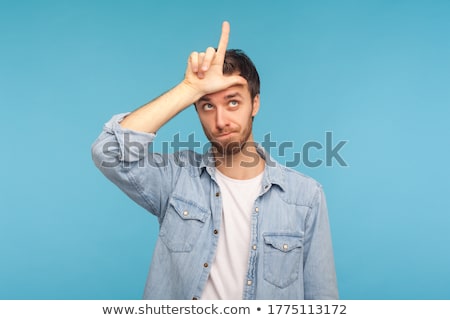 Foto d'archivio: Man Showing Loser With Sign Fingers Head