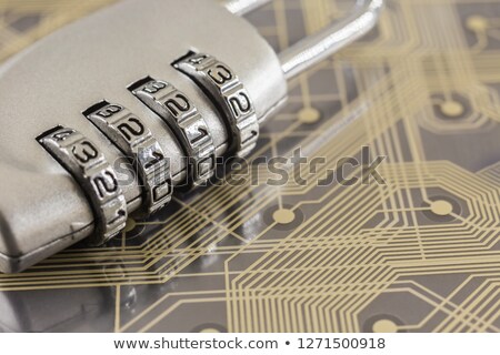 Foto stock: Combination Silver Padlock On Digital Circuits Background