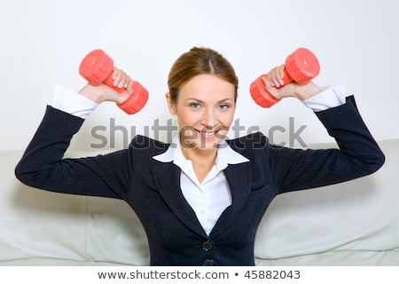 Stock photo: Businesswoman Exercising With Dumbbells