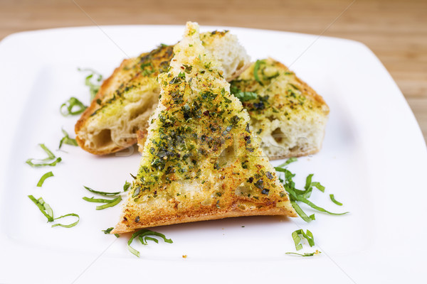 Freshly Baked Garlic Bread with herbs and butter  Stock photo © tab62