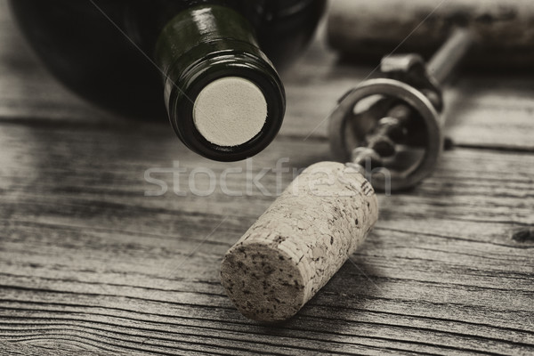 Vintage bottle of wine ready to open on aged wood  Stock photo © tab62