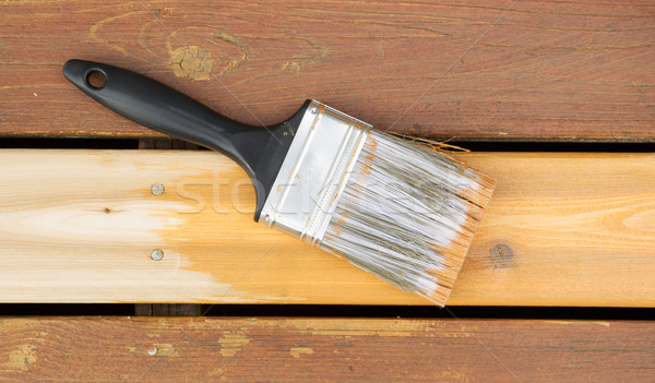 Stain being applied to new wooden board on outdoor deck  Stock photo © tab62