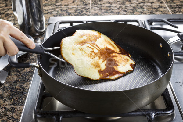 Golden Brown Pancake being Flipped Over  Stock photo © tab62