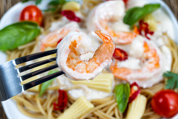 Extreme closep of cooked shrimp on fork  Stock photo © tab62
