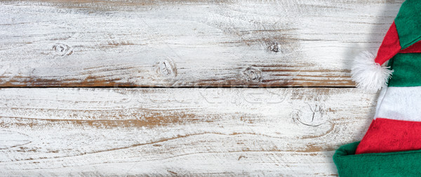 Christmas Elf hat on rustic knotty white wooden background  Stock photo © tab62