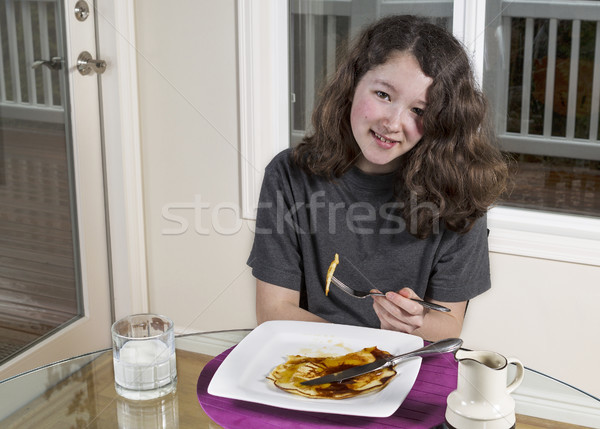 Young Girl eating pancake for her breakfast  Stock photo © tab62