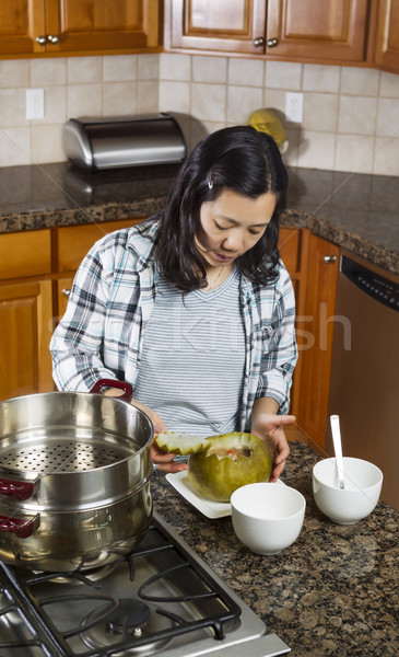 Mature Woman putting the finishing touches on Cooked Winter Melo Stock photo © tab62