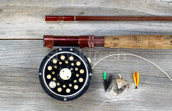 Old fly reel and rod on rustic wood  Stock photo © tab62
