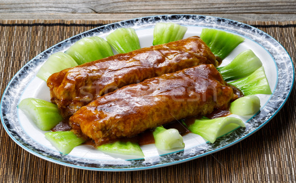 Meat wrapped in tofu with sauce and vegetables in serving plate  Stock photo © tab62