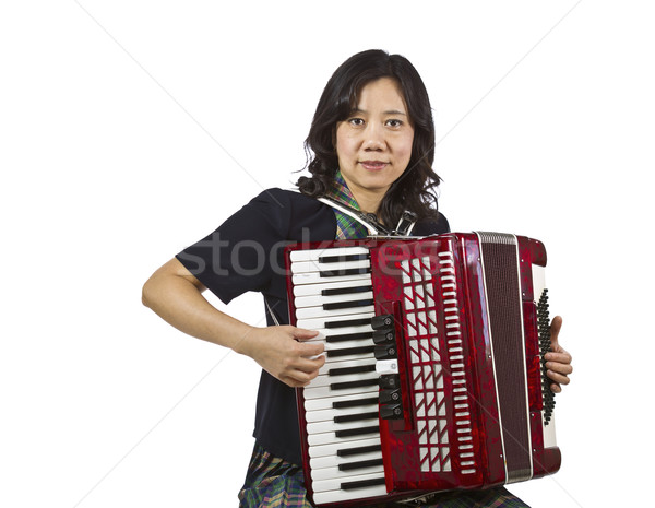 Asian kobiet gry akordeon posiedzenia Zdjęcia stock © tab62
