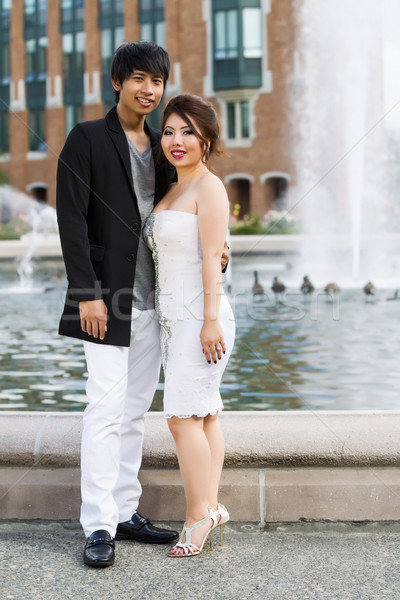 Young Adult couple standing in front of water fountain  Stock photo © tab62